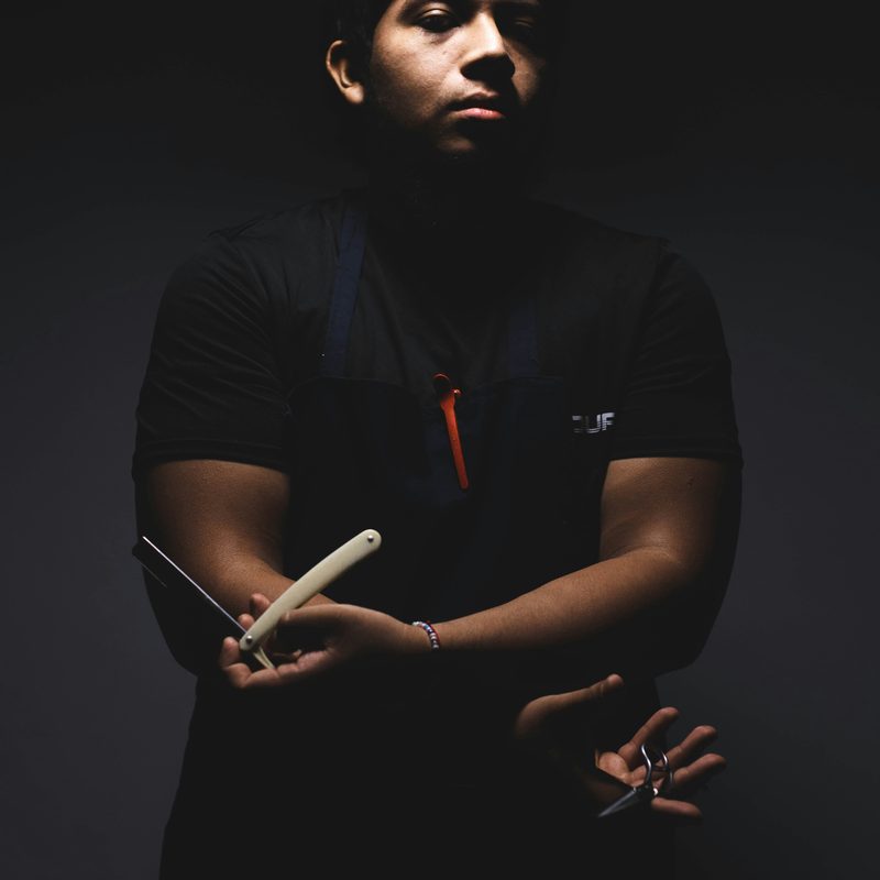 Kam, owner and master barber